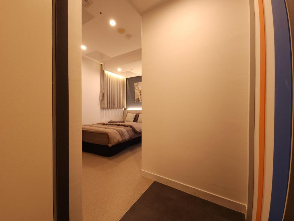 Postel nebo postele na pokoji v ubytování OYO Hostel Myeongdong 3
