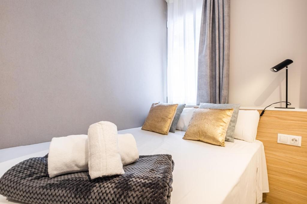 Postel nebo postele na pokoji v ubytování Mara Boutique Apartments