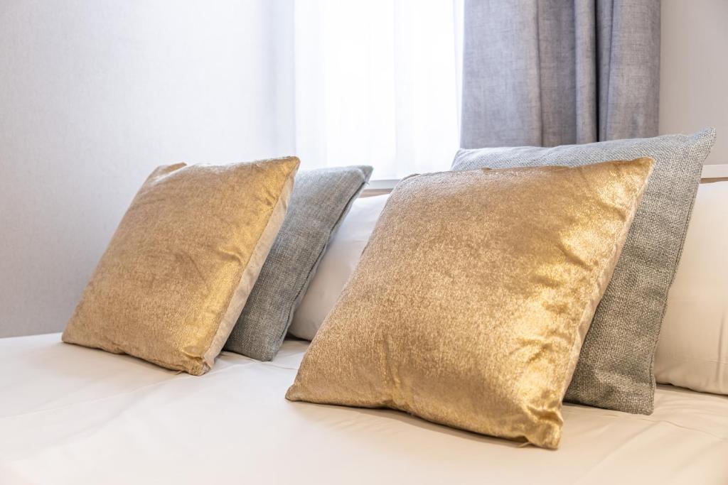 Postel nebo postele na pokoji v ubytování Mara Boutique Apartments