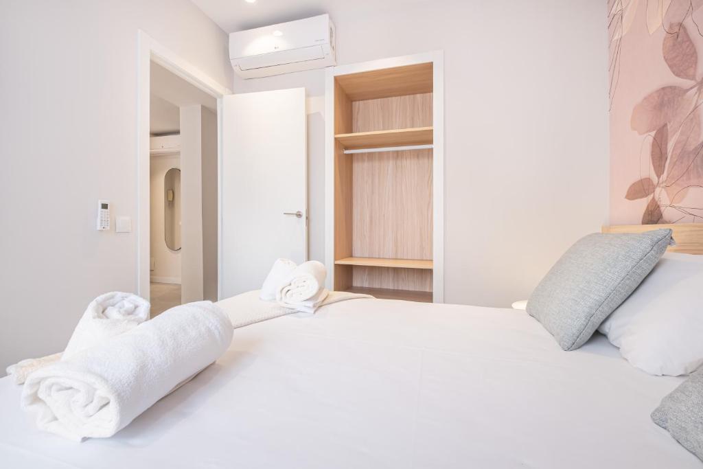 Postel nebo postele na pokoji v ubytování Mara Boutique Apartments