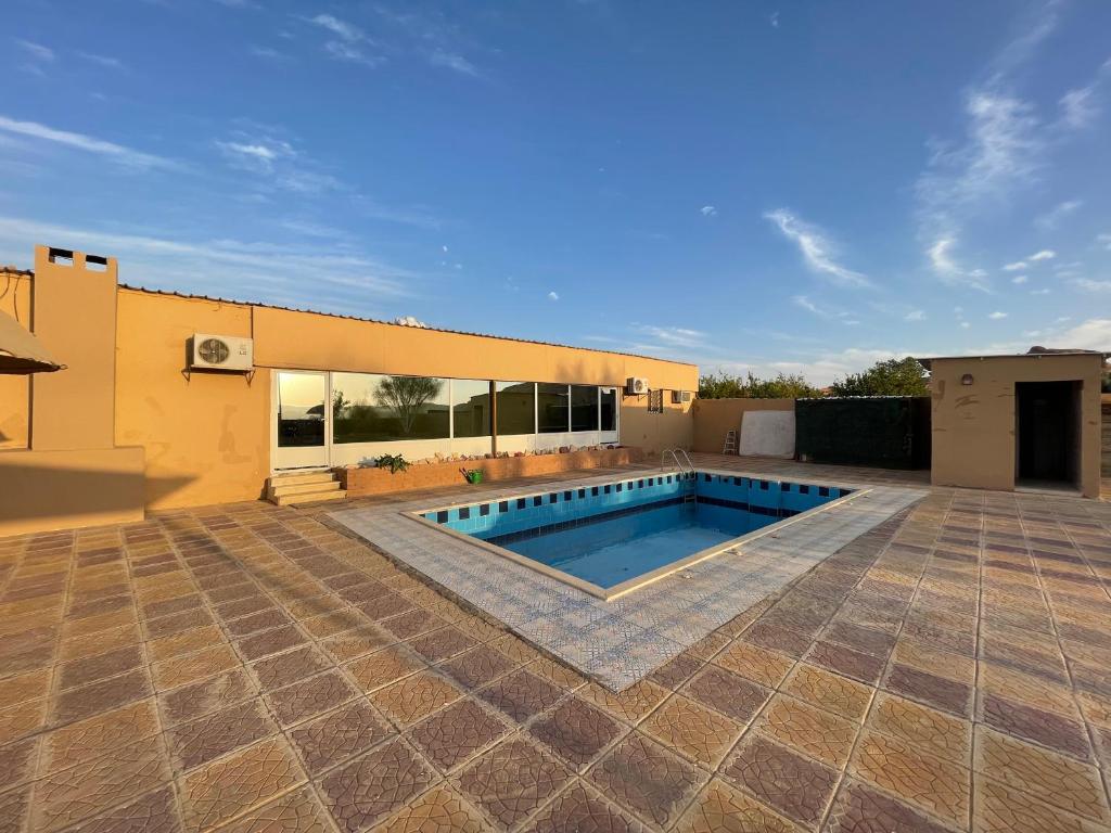 a swimming pool in the backyard of a house at سجى2 in Al-ʿUla