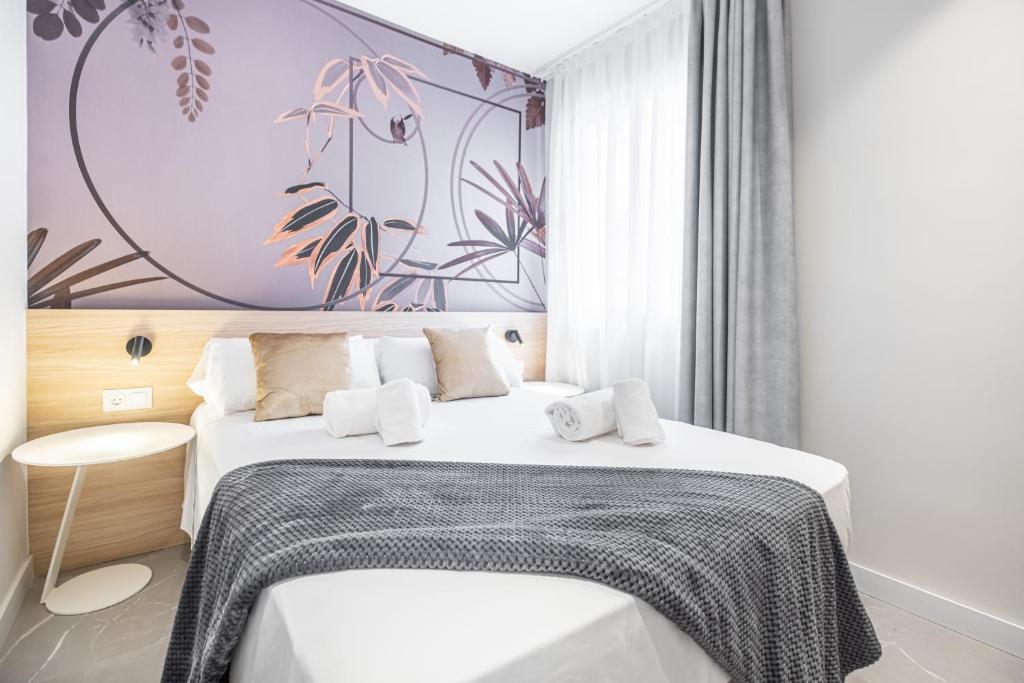 Postel nebo postele na pokoji v ubytování Mara Boutique Apartments