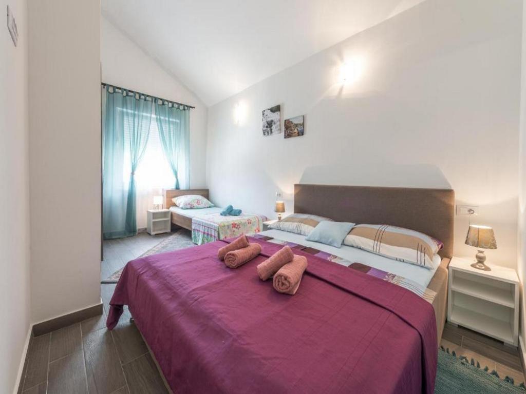 Posteľ alebo postele v izbe v ubytovaní Apartments Villa Soleil