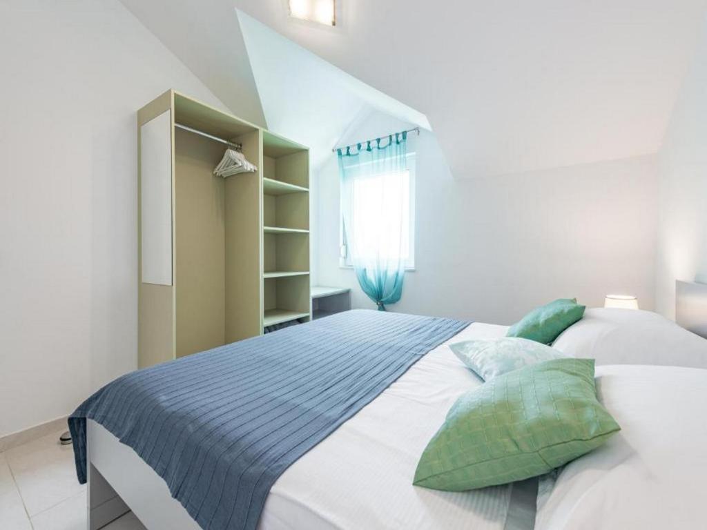Posteľ alebo postele v izbe v ubytovaní Apartments Villa Soleil