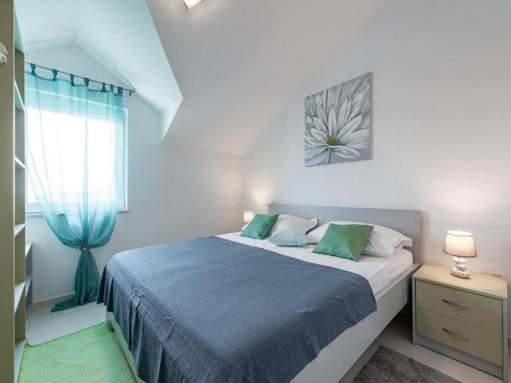 Posteľ alebo postele v izbe v ubytovaní Apartments Villa Soleil