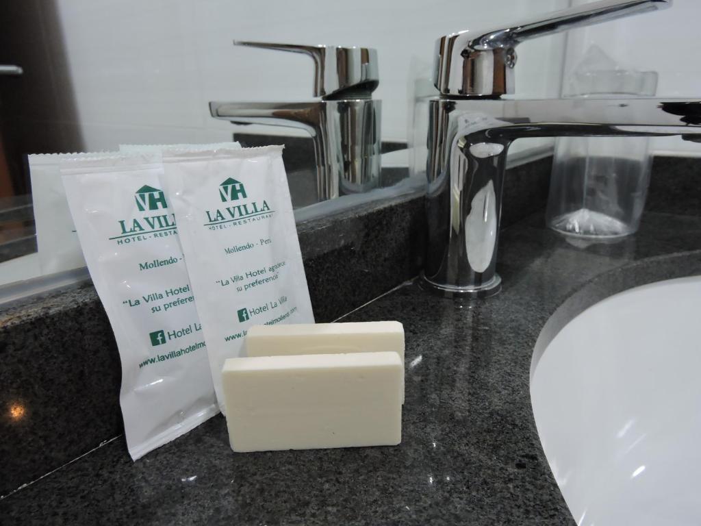 a bar of soap sitting on a counter next to a sink at Hotel La Villa Mollendo in Mollendo