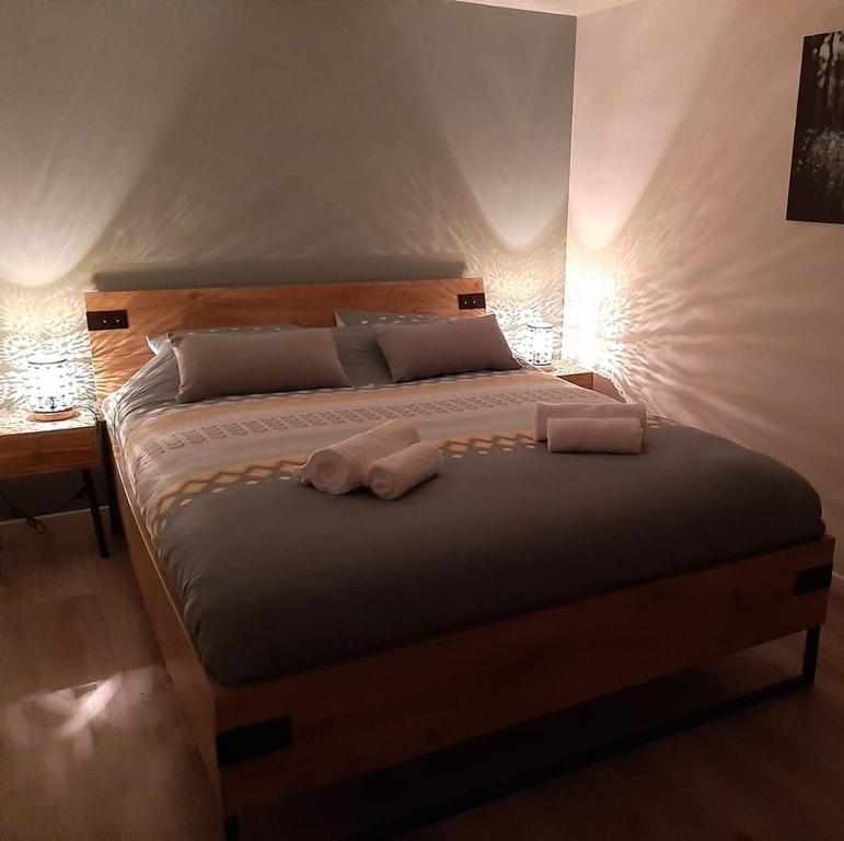 Postel nebo postele na pokoji v ubytování Gite de L'Ourthensia