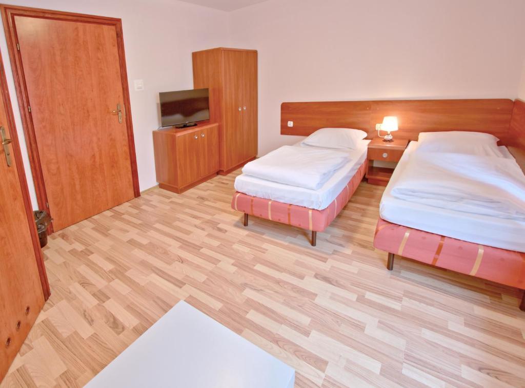 Postel nebo postele na pokoji v ubytování City Hostel