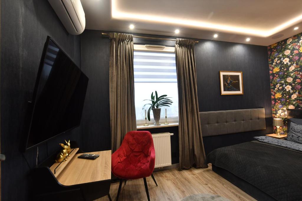 Televízia a/alebo spoločenská miestnosť v ubytovaní Green Penthouse