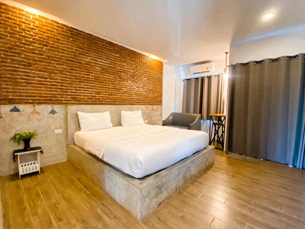 Postel nebo postele na pokoji v ubytování Pimchanok Resort