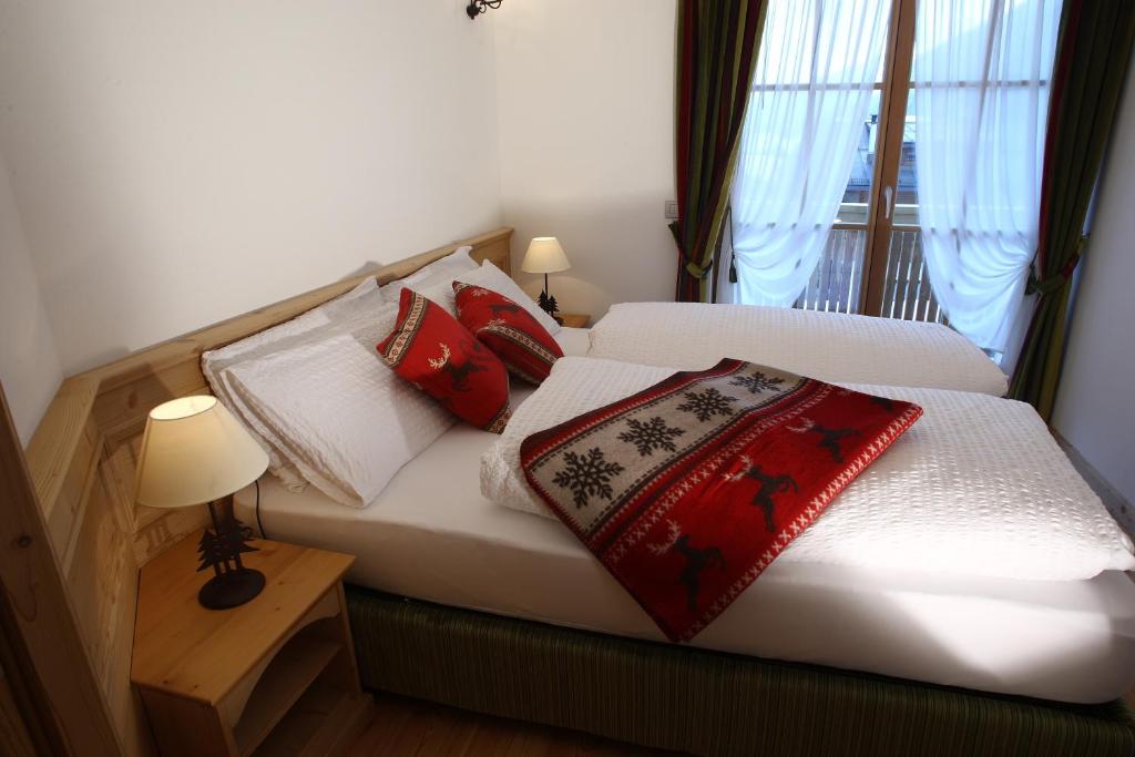 Postel nebo postele na pokoji v ubytování Apartments Sol E Nef