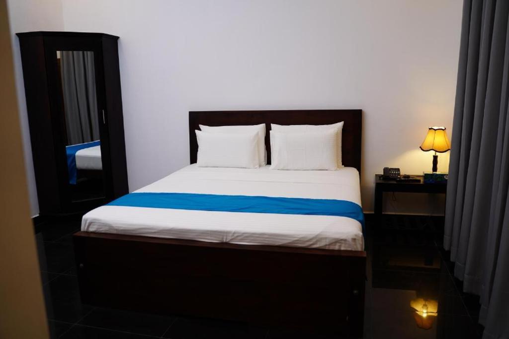 מיטה או מיטות בחדר ב-Village Hotel Northern Point
