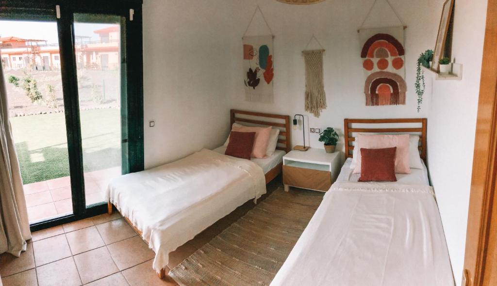 Postel nebo postele na pokoji v ubytování Casa Encanto