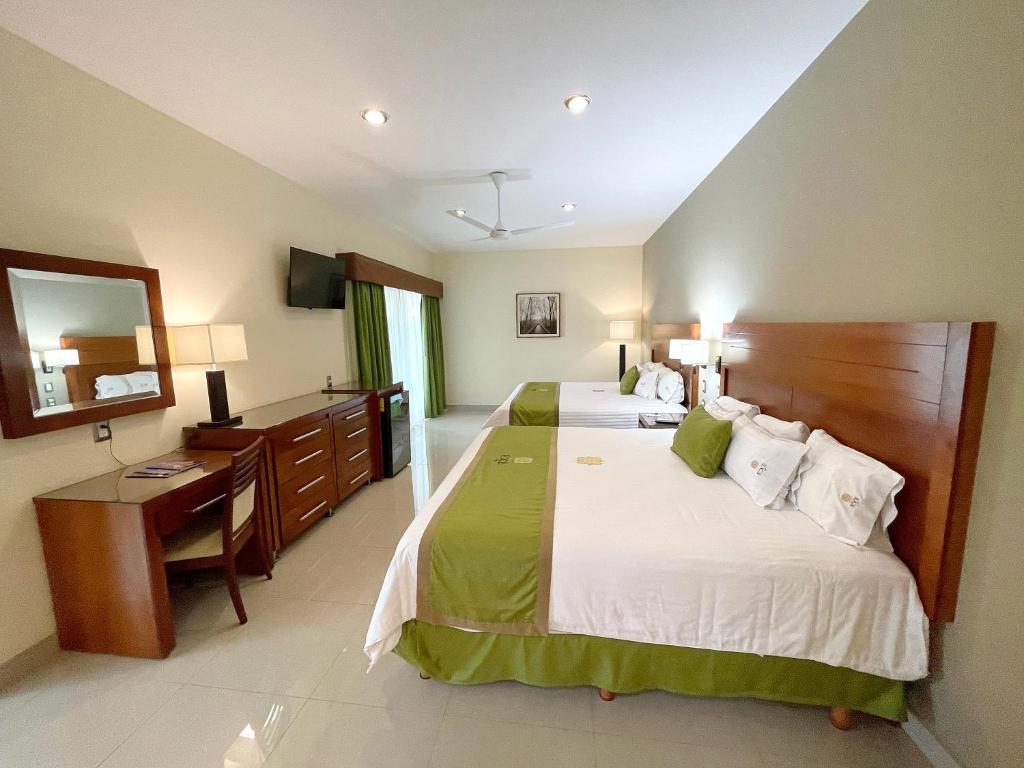 Postel nebo postele na pokoji v ubytování Hotel Ecce Inn & Spa