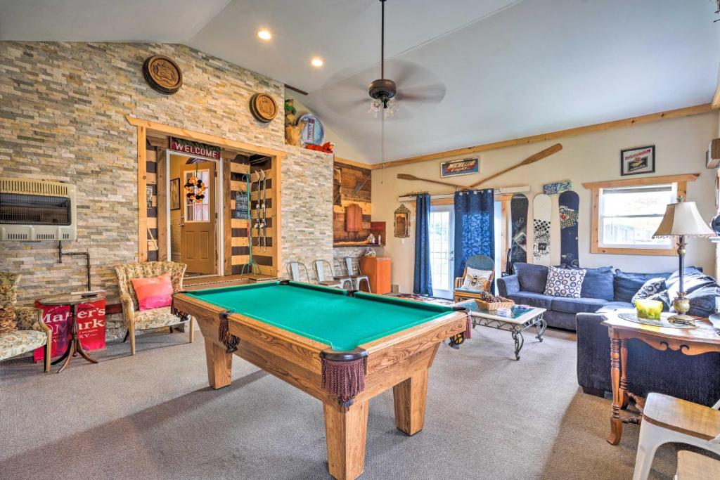 a living room with a pool table in it at Spacious Victorian Home quarter Mi to Holiday Valley! in Ellicottville