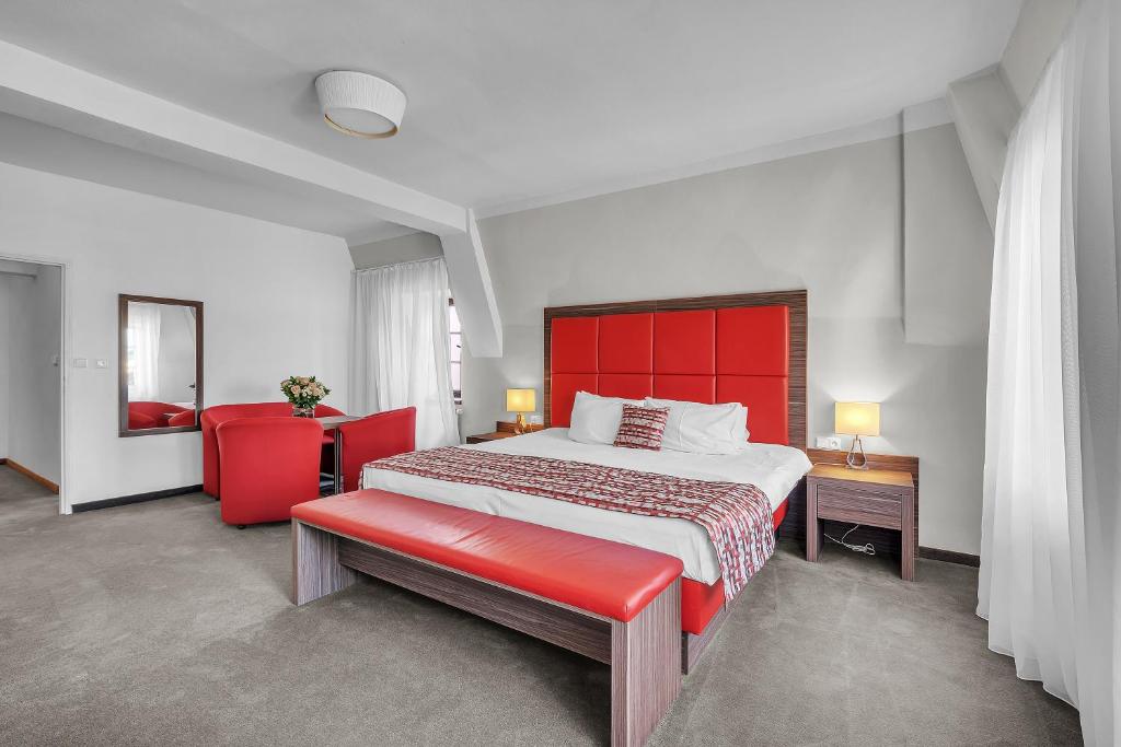 Postel nebo postele na pokoji v ubytování Hotel Nelly Kellys