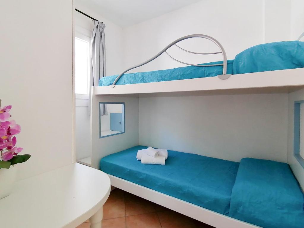 Posteľ alebo postele v izbe v ubytovaní Vigna Marina Apartments