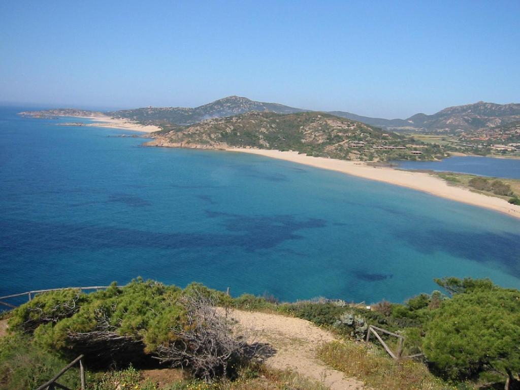 a view of a beach and the ocean at Hotel Su Giudeu in Chia