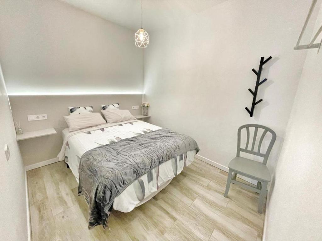 Posteľ alebo postele v izbe v ubytovaní Sol Apartamentos Centro Histórico
