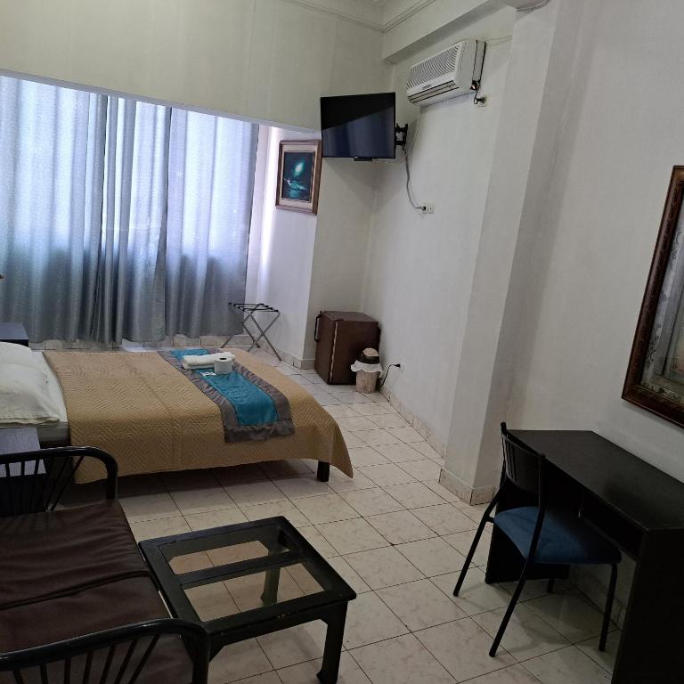 Postel nebo postele na pokoji v ubytování Atlantic Suites Hotel