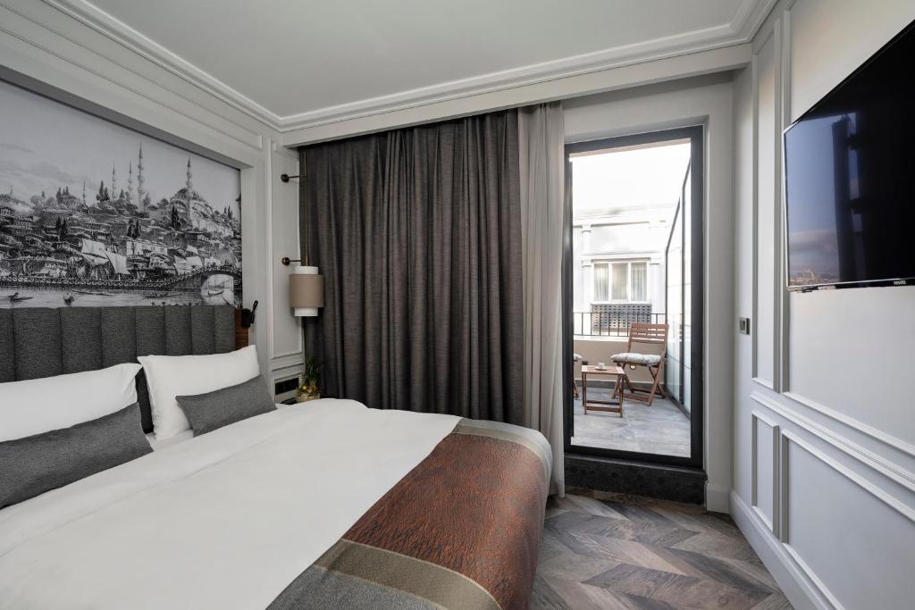 Postel nebo postele na pokoji v ubytování Livro Hotel