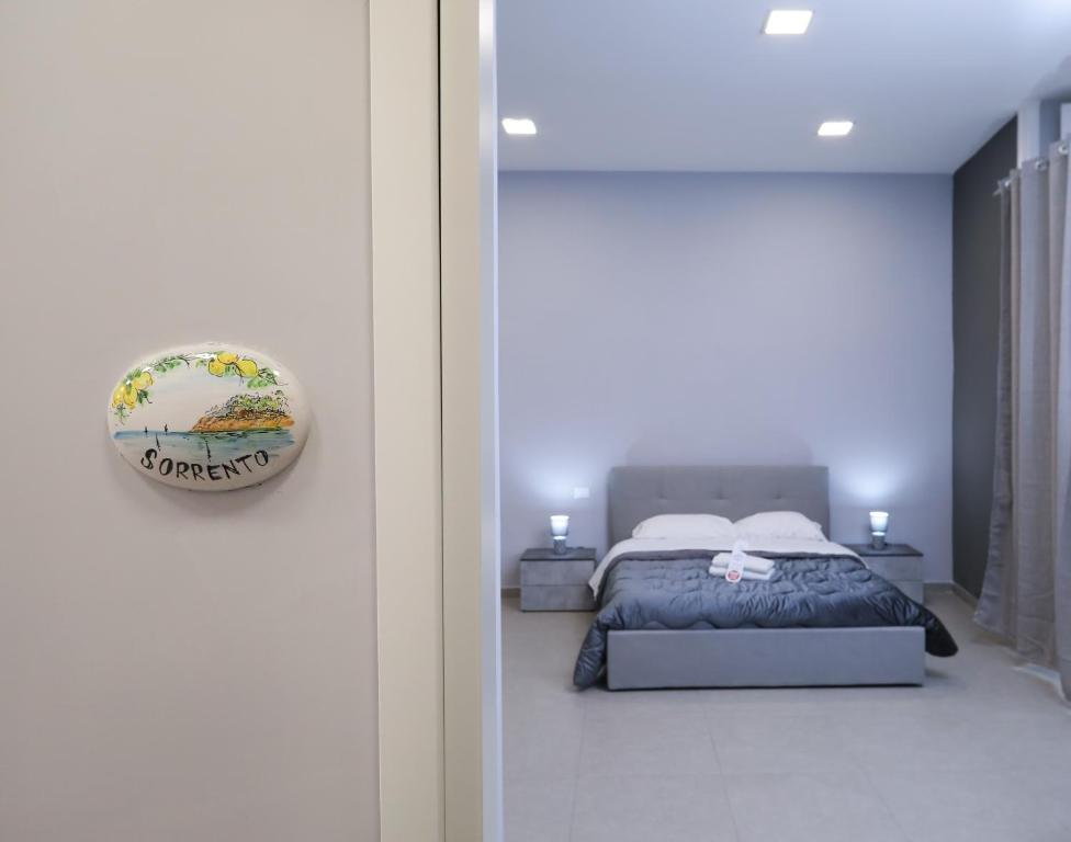 a bedroom with a bed and a door with a mirror at RESIDENZA ESPOSITO in Naples