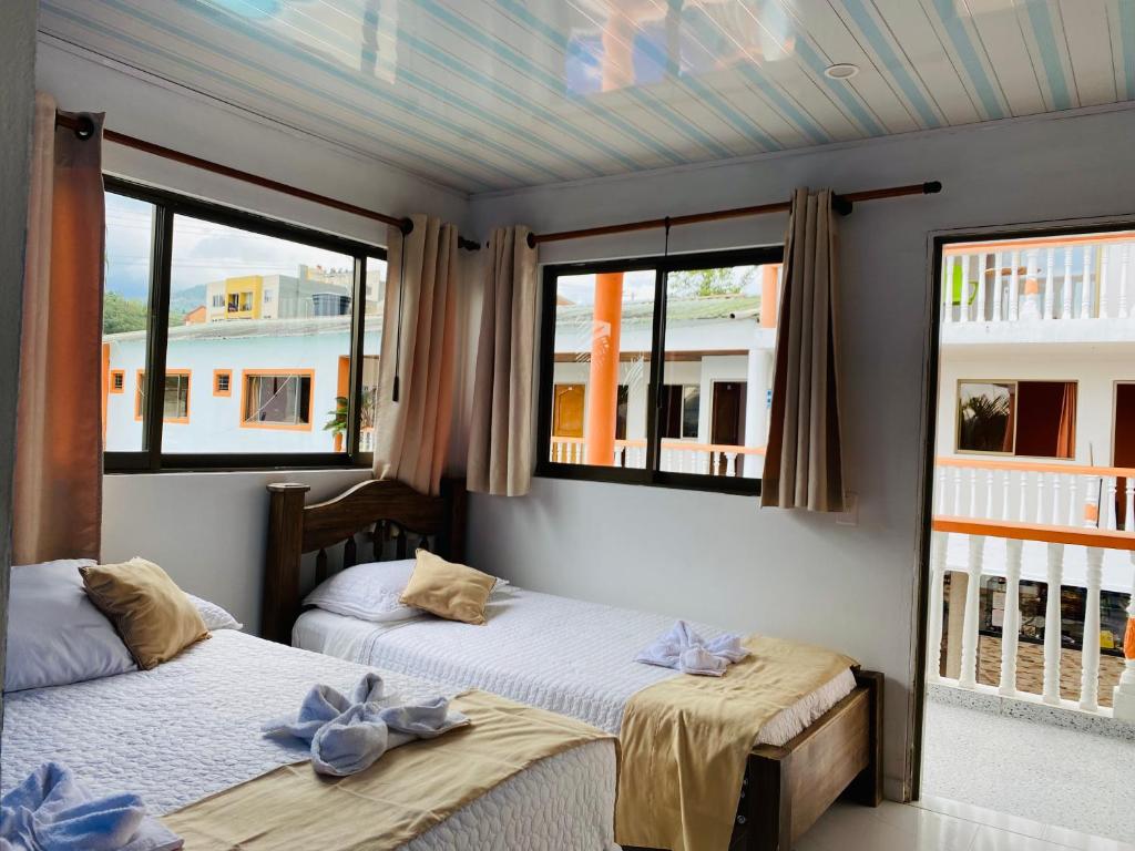 Postel nebo postele na pokoji v ubytování Hotel Caribe La Vega