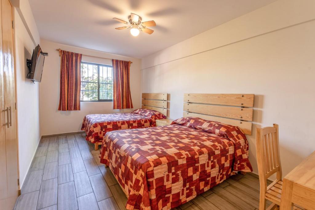 Postel nebo postele na pokoji v ubytování Hotel Meson de Sara