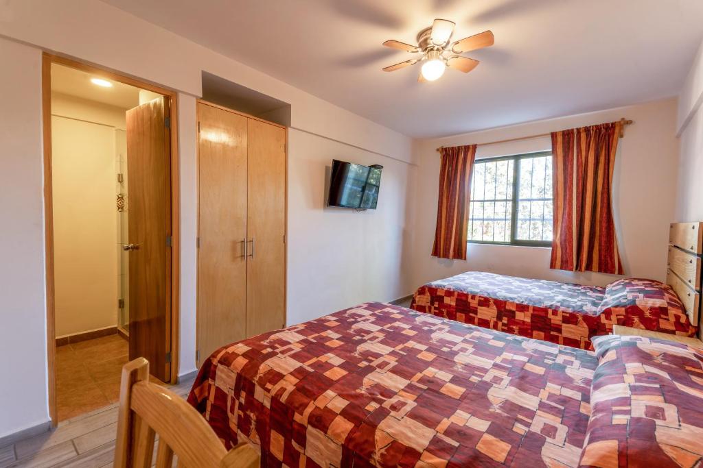 Postel nebo postele na pokoji v ubytování Hotel Meson de Sara
