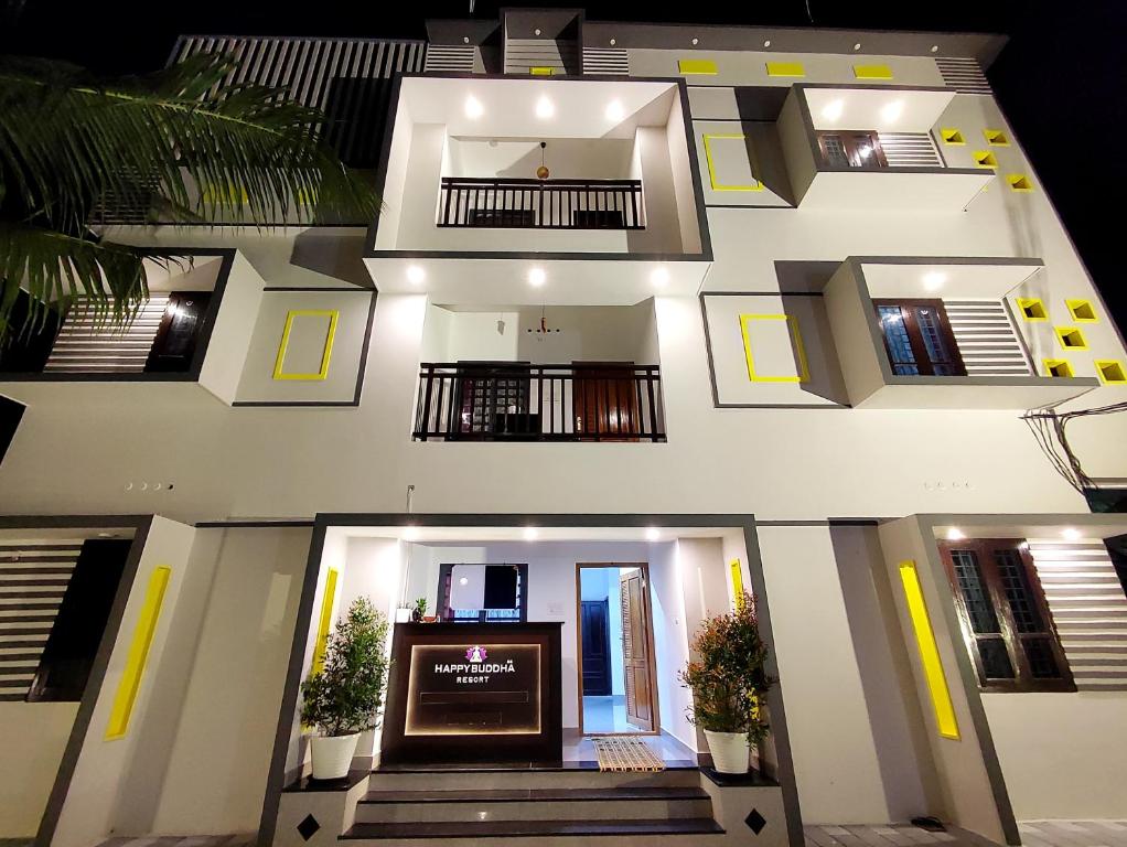 an aerial view of a building with stairs and balconies at Happy Buddha S4 in Varkala