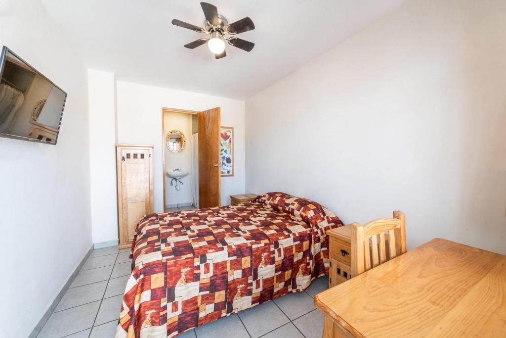 Postel nebo postele na pokoji v ubytování Hotel Meson de Carolina
