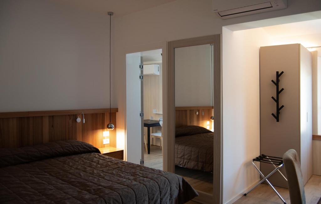 Postel nebo postele na pokoji v ubytování Hotel Oliva