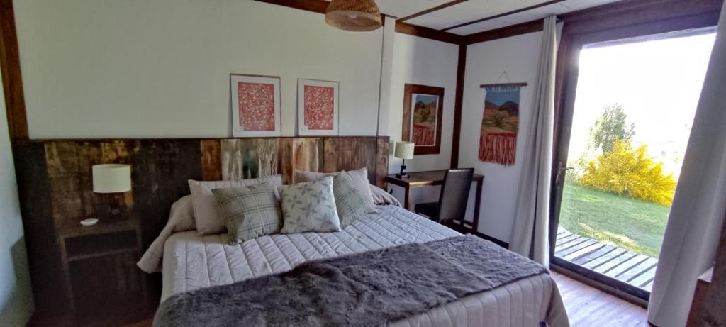 Postel nebo postele na pokoji v ubytování Refugio Los Cipreses Hotel