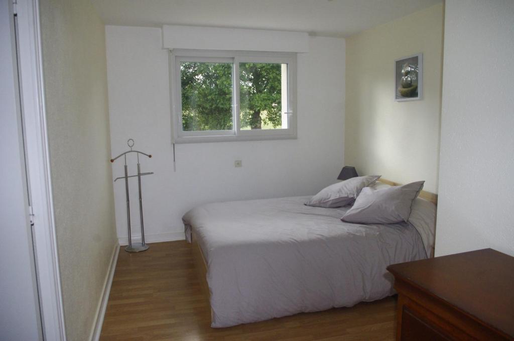 Postel nebo postele na pokoji v ubytování Gîtes du Clos du Ratz