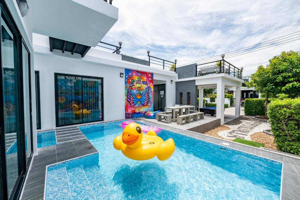 a house with a pool with a rubber duck in it at PP Pool Villa Huahin in Hua Hin