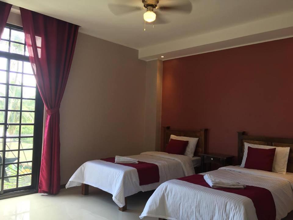 Postel nebo postele na pokoji v ubytování Answer hotel