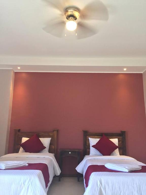 Postel nebo postele na pokoji v ubytování Answer hotel