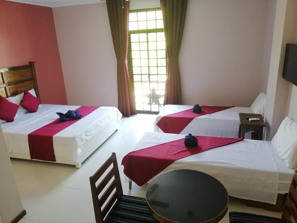 Postel nebo postele na pokoji v ubytování Answer hotel