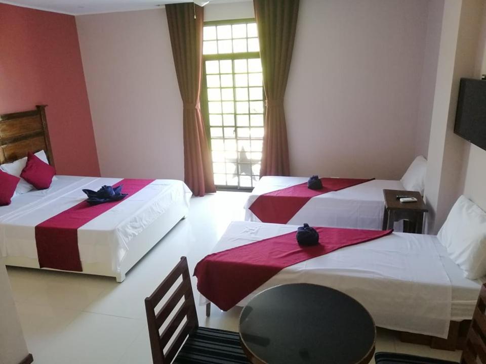 Postel nebo postele na pokoji v ubytování Answer hotel
