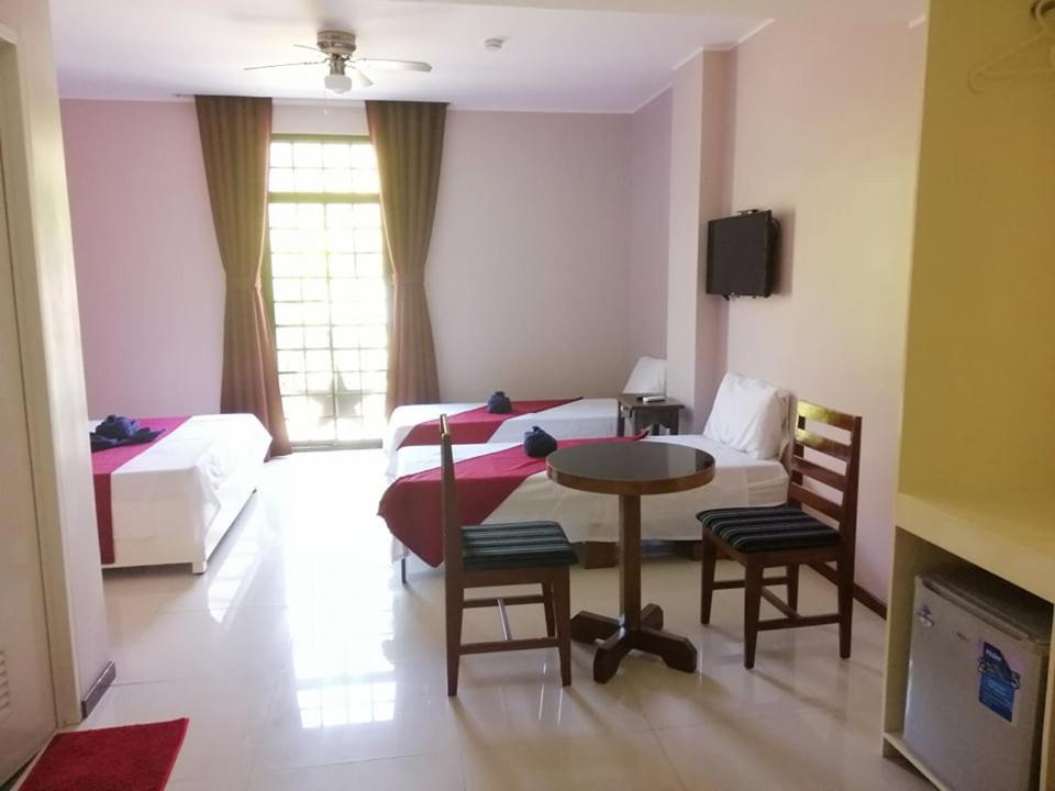 Postel nebo postele na pokoji v ubytování Answer hotel