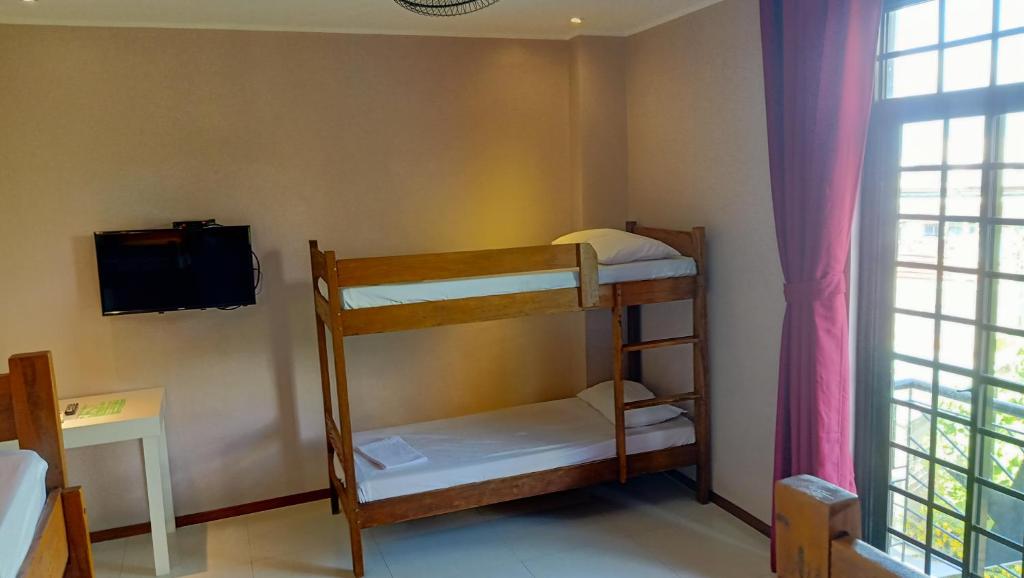 Postel nebo postele na pokoji v ubytování Answer hotel