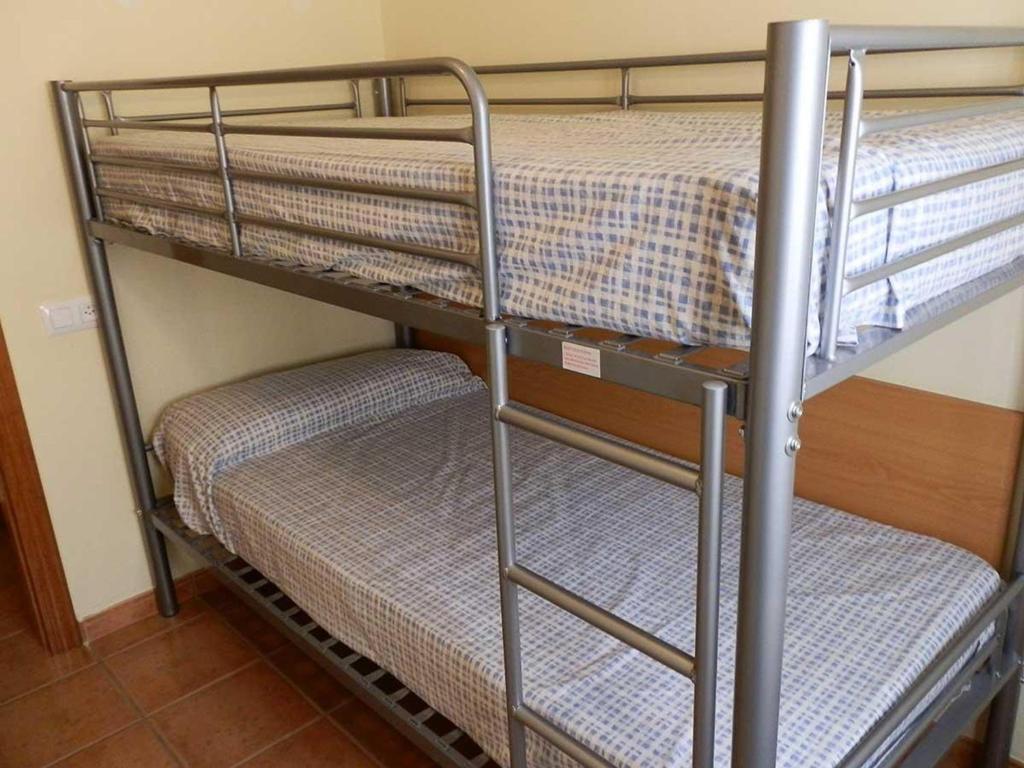 Posteľ alebo postele v izbe v ubytovaní Casa con Piscina Privada, Cerca del Mar, WiFi Gratis, Aire Opcional, Mascotas y Playa para Perros - ES-184-10