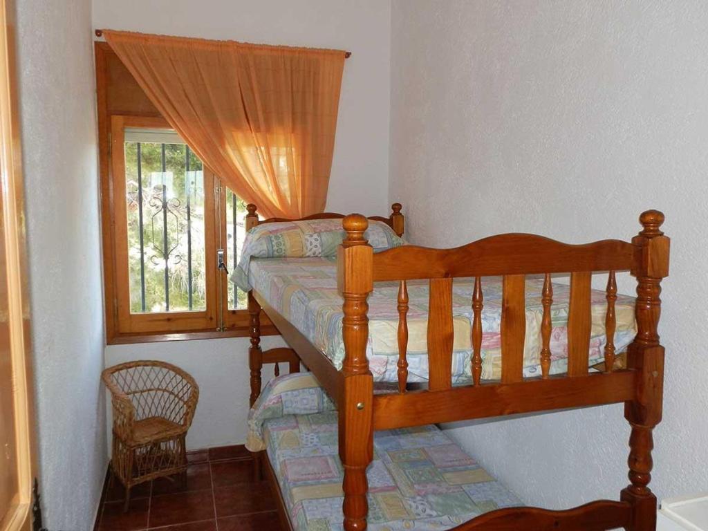Posteľ alebo postele v izbe v ubytovaní Casa cerca del mar con piscina privada, wifi, aire acondicionado opcional y mascotas bienvenidas - ES-184-23