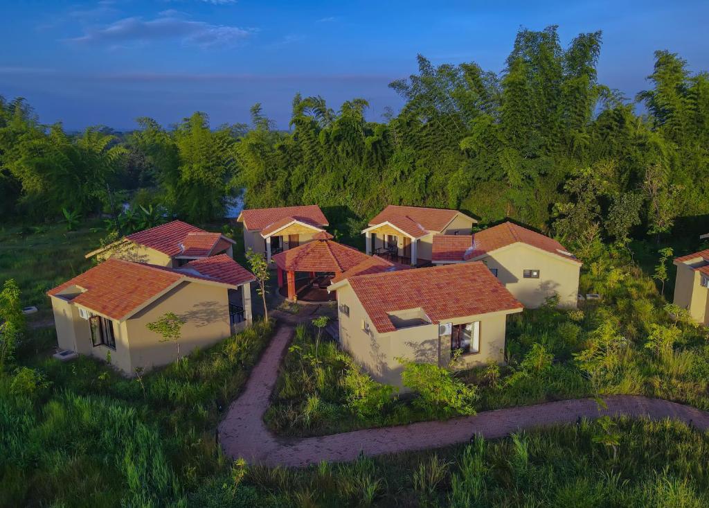 an overhead view of a group of houses with red roofs at Aranyak Resort Kanha in Dhanwār