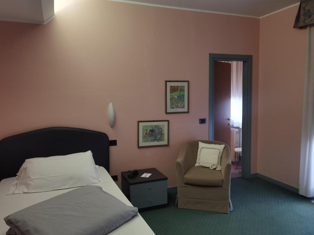 Postel nebo postele na pokoji v ubytování Hotel Vittoria
