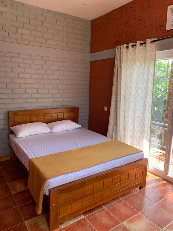 Postel nebo postele na pokoji v ubytování FernHills Homestay