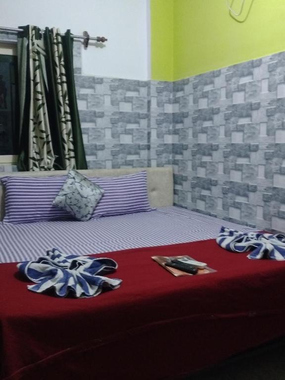 Postel nebo postele na pokoji v ubytování Baga F Leisure Stay Guest House