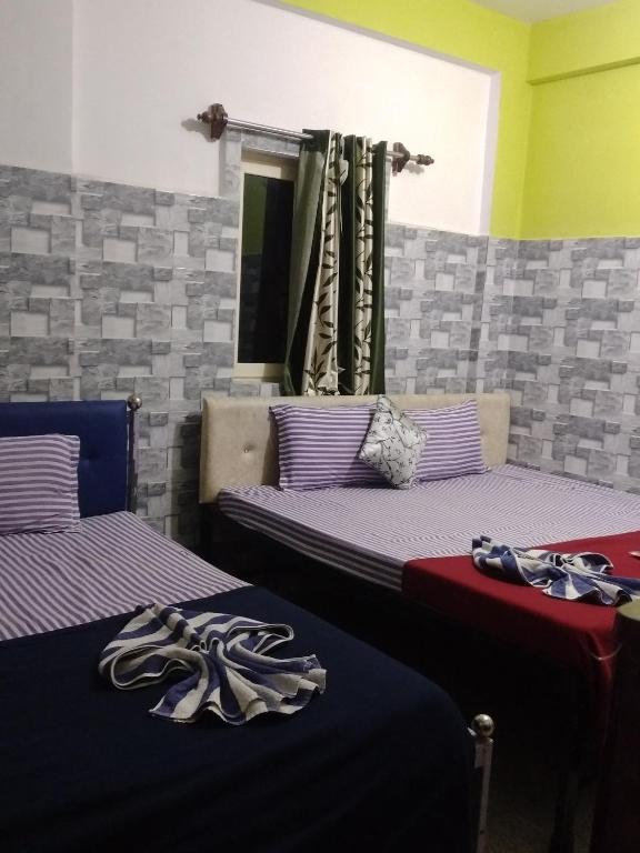 Postel nebo postele na pokoji v ubytování Baga F Leisure Stay Guest House