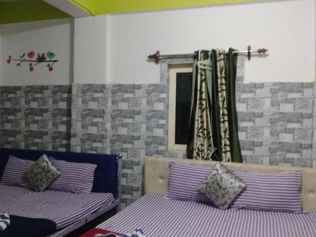 Postel nebo postele na pokoji v ubytování Baga F Leisure Stay Guest House