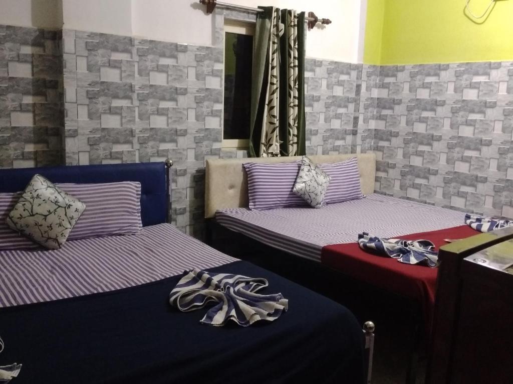Postel nebo postele na pokoji v ubytování Baga F Leisure Stay Guest House